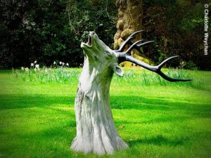 Unique Tree Stump Idea with deer sculpture